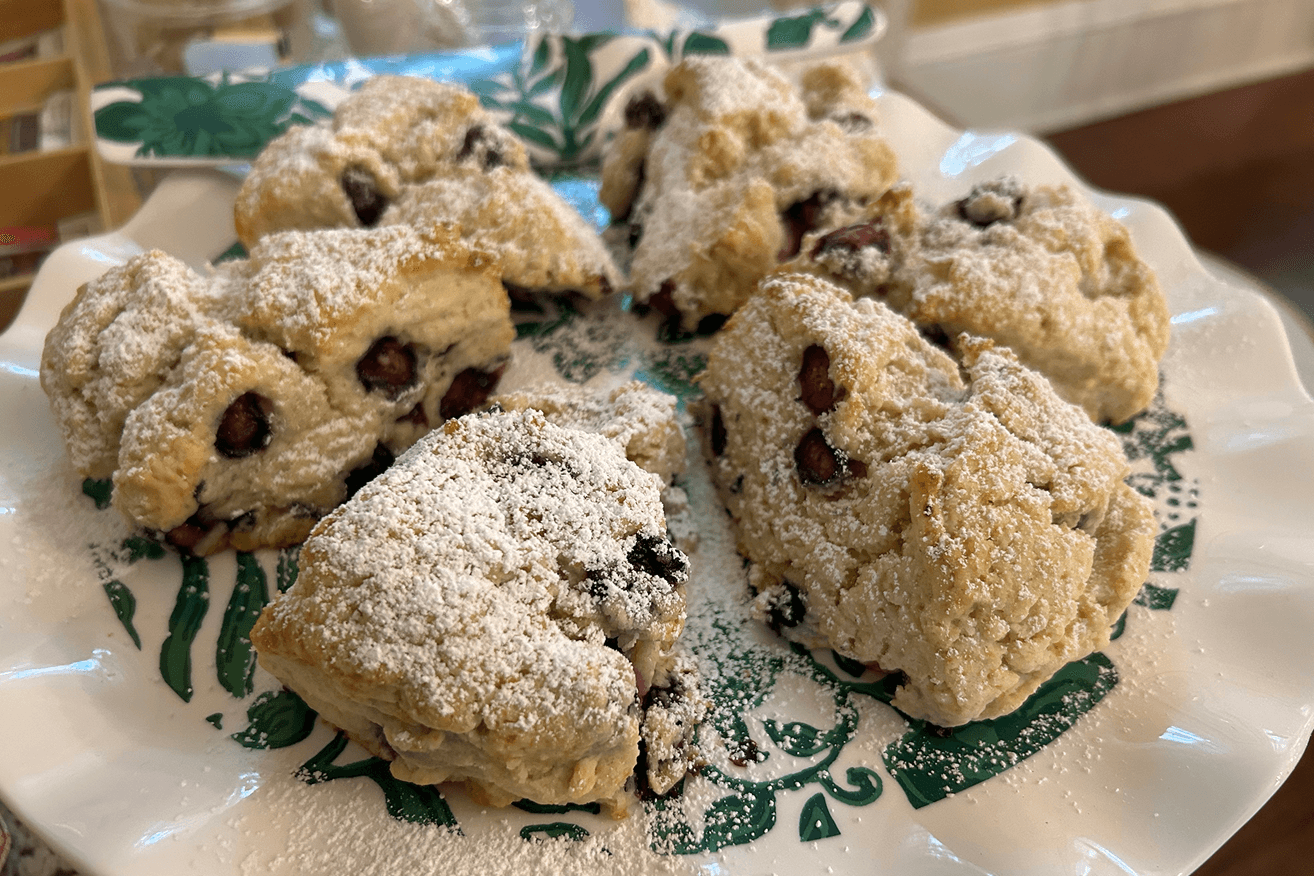 Plate of six raisin scones cut into wedges